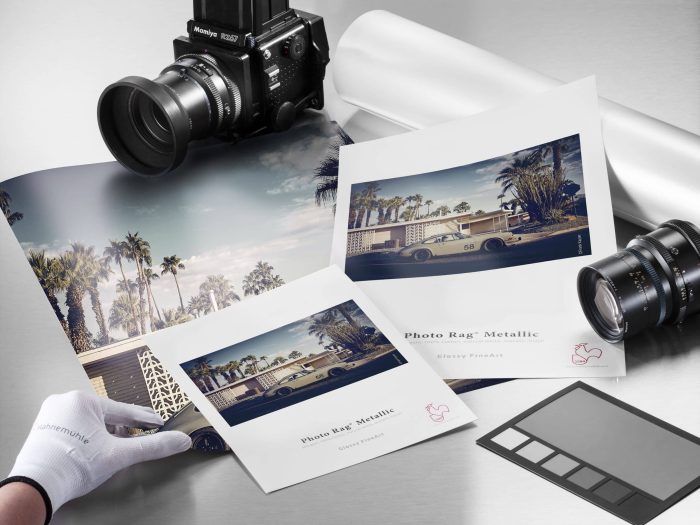 a camera and pictures on a table